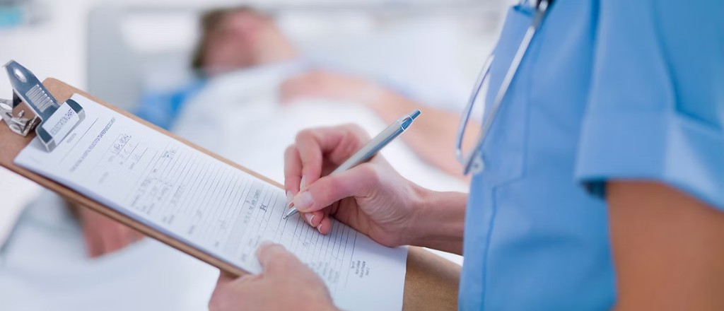 Medical professional documenting patient care